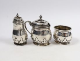 A George V silver oval three piece condiment set, Birmingham, 1913, lacking spoons.
