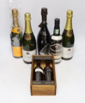 A bottle of Champagne Colin grand cru, Veuve Clienquot, two bottles of Champagne Veuve Bernard, a