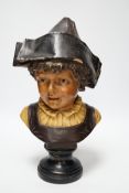 A French cold painted terracotta bust of a child in a bicorn hat on socle plinth, 37cm high