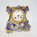 An early 20th century French porcelain mantel clock, missing top section, 19cm
