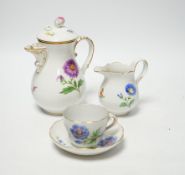 A 20th century Meissen coffee set with floral decoration, comprising a coffee pot, a milk jug, a