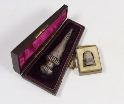 A cased late Victorian teardrop shaped silver scent bottle, Birmingham, 1885, 78mm and a cased