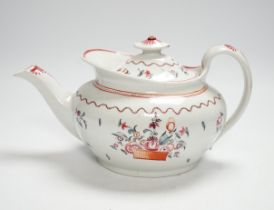 A Newhall porcelain boat shaped teapot, c.1800 with floral decoration, 25cm wide