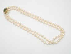 A Portuguese single strand cultured pearl necklace, with cabochon nephrite and seed pearl cluster