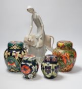 Four modern Moorcroft jars and covers, largest 16cm high, three boxed and a Nao figure group,