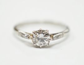 An 18ct, plat. and single stone diamond ring, with diamond set shoulders, size M/N, gross weight 1.9