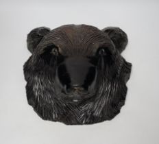 A Japanese carved wall hanging bear's head, 32cm high