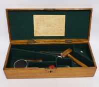 An oak Colt pistol box, felt lined compartments containing a few tools including a bullet mould,