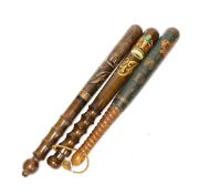 Three painted wooden truncheons: William IV, Victoria and George V, largest Victoria 42cm long