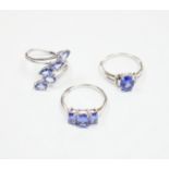 Three assorted modern 9ct white gold and tanzanite set dress rings, gross weight 8.4 grams.