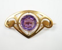 An Art Nouveau style yellow metal and single stone round cut amethyst set brooch, 35mm, gross weight