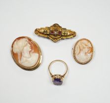 Two 9ct mounted oval cameo shell brooches, largest 38mm, a 9ct and gem set ring and a 9ct gold and