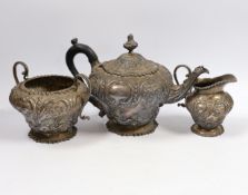 A late Victorian embossed silver inverted pear shaped three piece tea set, W & C Sissons, London,