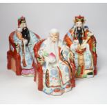 A set of three Chinese famille rose figures of the Three Star Gods (Sanxing), largest 25cm high
