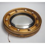 A small Regency style convex wall mirror, 31.5cm diameter