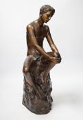 A bronze seated nude, 50cm