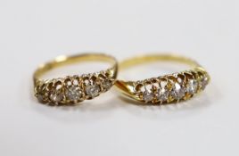 A late Victorian 18ct gold and graduated five stone diamond set half hoop ring, size M/N and an