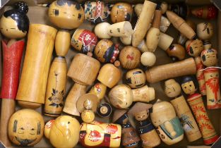 A quantity of Kokeshi wooden dolls