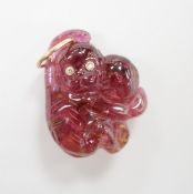 A novelty pink tourmaline and two stone diamond set pendant, modelled as a monkey, 25mm.