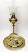 A Victorian brass oil lamp with glass shade, two brass chargers and a match box cover, oil lamp 72