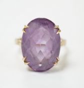 A modern 9ct gold and oval cut amethyst set dress ring, size M, gross weight 5.9 grams.