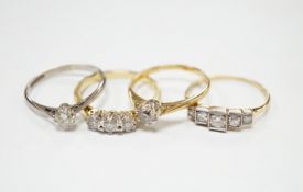 Four assorted 18ct and diamond set rings including a graduated five stone, three stone and two