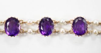 A 1970's Edwardian style 9ct gold amethyst and cultured pearl cluster set bracelet, 17.5cm, gross