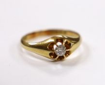 A late Victorian 18ct gold and claw set solitaire diamond ring, size U, gross weight 4.7 grams.