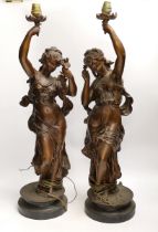 A pair of patinated spelter figural lamp bases, 63high not including light fitting