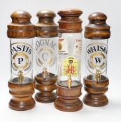 Four spirit vessels, whisky, pastis, cognac, and another, tallest, 38cm