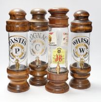 Four spirit vessels, whisky, pastis, cognac, and another, tallest, 38cm