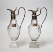 A pair of late 18th/early 19th century silver mounted cut glass cut glass cruet bottles with