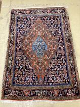 A Qashqai blue ground rug, 166 x 114cm