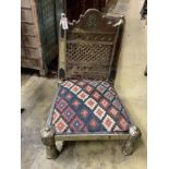 An Afghan metal mounted low chair with Kilim seat, width 59cm, depth 59cm, height 76cm