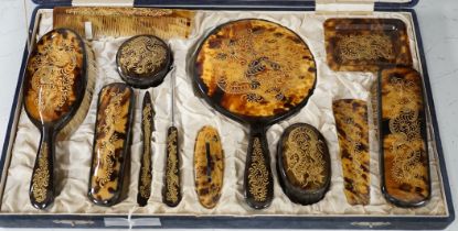 A cased Japanese tortoiseshell dragon decorated dressing table set, c.1940 (with original packing