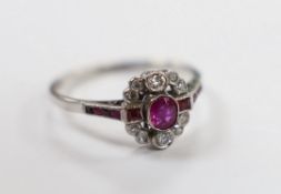 An Art Deco style 18ct white gold, ruby and diamond set cluster ring, size Q, gross weight 3.1
