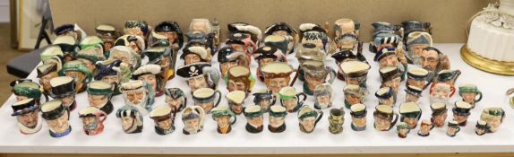 A large collection of Doulton character jugs including the Three Musketeers and Bacchus, largest