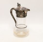A late Victorian embossed silver mounted glass decanter, with rampant lion finial, Edward Charles