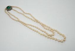 A double strand graduated cultured pearl necklace, with two colour paste set white metal clasp,