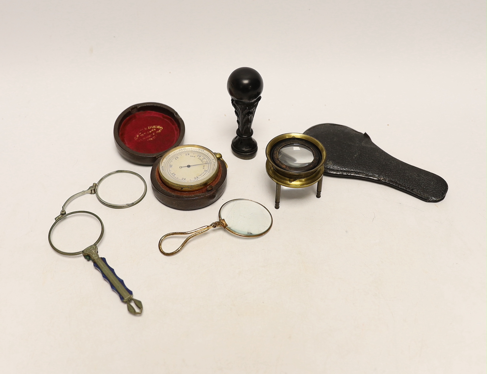 A pocket barometer, carved wood ‘stag head’ seal, lorgnette and eyeglass