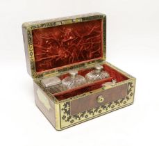 A William IV Cut brass, mahogany and ebony travelling vanity box, with silver-capped bottles, 24.5cm