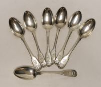 A harlequin set of seven early 19th century silver fiddle and shell pattern table spoons, various