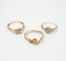 Three modern 9ct gold and diamond set rings, including solitaire and cluster, gross weight 5.9