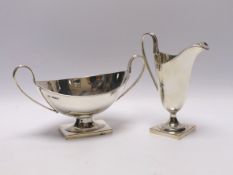 A George VI silver cream jug and two handled sauceboat by Viners Ltd, Sheffield, 1937, jug height