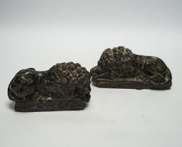 A pair of carved serpentine models of the Lucerne lions, 16cm wide