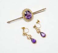 A yellow metal, amethyst and seed pearl cluster set bar brooch, 65mm and a pair of similar drop