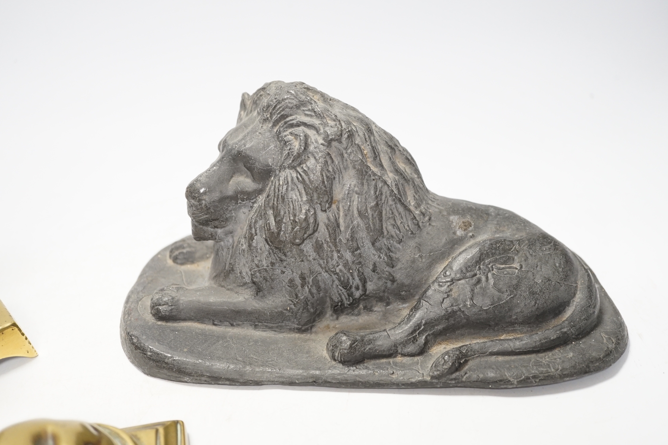 A 19th century brass recumbent lion, a similar cast iron lion and a smaller lion, largest 22cm wide - Image 4 of 5
