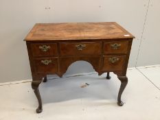 A Queen Anne revival feather banded walnut kneehole dressing table (front leg a/f), width 88cm,