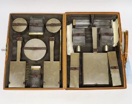 A George VI pig skin travelling vanity case, containing fourteen engine turned silver gilt mounted