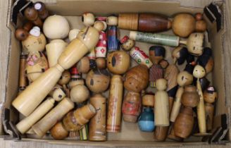 Quantity of over forty Japanese Kokeshi dolls, largest 34cm high